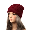 Women's warm winter knitted beanie cap in burgundy red finish shown on mannequin head - Burgundy