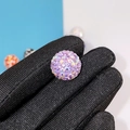 Sparkling purple pavé crystal clay bead held between fingers for DIY jewelry - 16mm AB Light Purple Round Bead