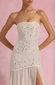 Detailed view of white strapless dress featuring silver rhinestones and ruffled mesh hem - S / White
