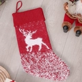 Charming red knitted Christmas stocking featuring white reindeer patterns and hanging loop - Elk Style