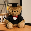 Brown plush graduation teddy bear in black cap and gown with a bright yellow tassel - Red Bow Tie Suit Style