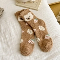 Brown coral fleece socks with cute bear and strawberry patterns on a cozy white bed - One Size / Dark Brown