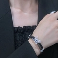 Silver butterfly charm bracelet with black leather band worn on model wrist - Antique Silver Butterfly Leather Bracelet Style (K-1163)