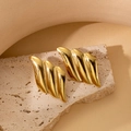 Golden wave textured earrings in irregular geometric design on minimalist stone - Threaded Wavy Studs
