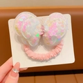 Pink sequin bow hair tie with iridescent finish on a white card display - White Sequin Bow (Hair Tie)