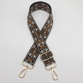 Détail de la bandoulière jacquard réglable avec motif floral et crochets dorés - Noir Brun Crochet Doré