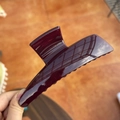 Detailed close-up of a large glossy burgundy hair claw clip held by hand - XL Butterfly Buckle (Approx. 13.5cm) / Cherry Red