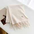 Soft cream white wool scarf with fringe and minimalist brand label on a flat surface - White / Over 175cm