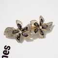 Elegant gold-tone hair clip featuring grey crystal petals and white pearl centers - Yao Fang Graphite Black