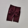 Detailed view of seamless scrunch butt lifting yoga shorts in deep burgundy red wine - Grape Purple