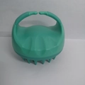 Mint green silicone scalp massage brush with ergonomic handle for hair washing - Green