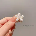 Mini gold flower hair claw clip with white pearl detail, approx. 1.5cm in size - Single Pearl Flower