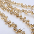 Macro detail of amber faceted glass strawberry beads for DIY jewelry and accessory making - Amber Gold