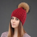 Winter wool knit beanie in red with a large natural faux fur pompom for warmth - Wine Red + Natural Pom-pom