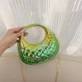 Detail of gradient green and gold quilted acrylic shell clutch with metallic chain strap - Yellow & Green