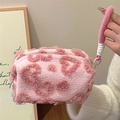 Plush pink makeup bag featuring heart patterns and soft woven carrying handle - Handheld Plush Pink Heart