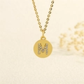 Elegant gold chain necklace featuring a circular pendant with sparkling letter M inlay - Letter M