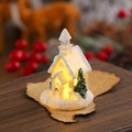 Dettaglio di una casa di Natale in resina bianca con luce LED calda su carta vintage - Bianco Stile D (Casetta)