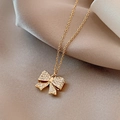 Golden bow pendant necklace with micro-set zircon stones on premium silk background - Titanium Steel Gold Style (X378)