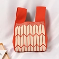 Knit tote bag with bright orange and cream geometric chevron patterns - Redmi With Combined Arrows