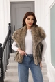 Brown faux fur vest with large lapel collar shown in full length on a female model - S / Brown