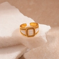 Macro shot of vintage gold adjustable ring with white textured inlay and zircon pavé - Mother of Pearl Zircon Ring / White