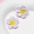 Macro detail of light purple resin frangipani flower earrings in a white ceramic dish - Small Light Purple