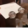 Close-up of silver earrings with irregular lava texture and metallic glossy finish - Metallic Ball Studs / Silver