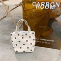 Detail of a beige corduroy mini tote bag with brown polka dots and a metal snap closure - Apricot Polka Dot
