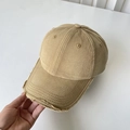 Close-up of khaki distressed cotton baseball cap with frayed edges and vintage texture - M(56-58cm) / Khaki