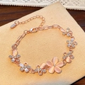 Elegant rose gold flower bracelet with pink cat eye stones and sparkling crystals - Rose Gold Pink Cat Eye Flower