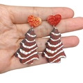 Close-up of festive Christmas tree earrings with red glitter heart studs and brown charms - Brown Christmas Tree
