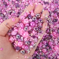 Close-up of pink and purple pearls mixed with iridescent rhinestones for DIY nail art - Deep Purple Rose Red Ab Series - Q / 30 g
