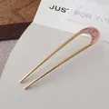 Elegant gold U-shaped hair pin featuring a pink marble resin head ornament - Crescent Moon Hair Stick - Pink