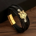 Detailansicht von schwarzem Lederarmband mit goldenem Tigerkopf und Magnetverschluss - Schwarz/Gold