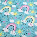 Sky blue wrapping paper featuring cartoon sun, rainbow, and smile motifs - Blue Rainbow Clouds