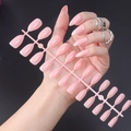 Close-up of 24pcs glossy pink almond press-on nails set displayed on a plastic sheet - Glossy Pink (JJL-29)