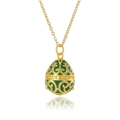 Macro view of vintage green egg pendant with gold pattern on white background - Green