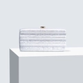 Elegant white acrylic evening clutch with marble texture and gold clasp on white stand - White