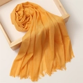 Detail of soft orange linen cotton scarf with frayed tassel edges in a wooden frame - 180*100cm / Light Ginger (TH39-51)