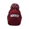 Detail view of burgundy knitted beanie with white MOMMIN embroidery and mixed color pom-pom - Burgundy