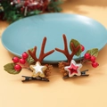 Festive reindeer antler hair clips with glitter stars and red berries on a beige surface - Christmas Clip Style 4
