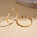 Polished gold geometric hoop earrings with flat C-shape design and clip-on backings - Clip-on Earrings / Gold