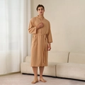 Men's warm camel waffle robe with V-neck, waist belt and pockets in a cozy home setting - Linen (Men)