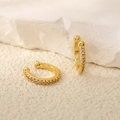 Macro shot of gold C-shaped ear cuffs with micro-pave cubic zirconia on stone base - 18K Gold Plated Pave Zirconia Ear Cuff