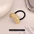 Golden irregular brushed metal hair tie with high elasticity black cord 5.3x2.2cm - Curved Lava Rock Gold