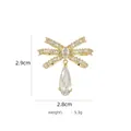 Eleganter goldener Schleifenbrosche mit Zirkonia-Kristallen und Tropfenanhänger - B742 Gold/Schleife