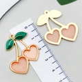 Pink and green resin cherry heart pendant with gold frame for DIY jewelry making - 1Pc Light Orange Glitter Heart Large Cherry (33x28mm)