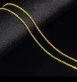 Elegant 18k gold plated titanium steel lip chain necklace on a dark background - Glitter Chain / Gold
