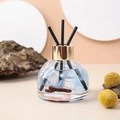 Detail of car reed diffuser glass bottle with blue dried flowers and golden cap decor - Set (Including Reed Sticks + Non-slip Mat) / Bluebell